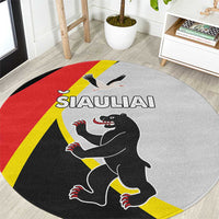 Round rug with SIAULIAI text, wolf and bird graphic, red yellow black design