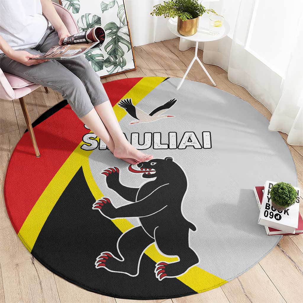 Round rug with SIAULIAI wolf and bird graphic, red yellow black flag-style design