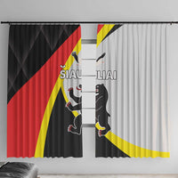 Black window curtain panel with red-yellow flag stripes and cat graphic