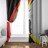 Black and light gray curtain panels with red-yellow flag print and cat illustration