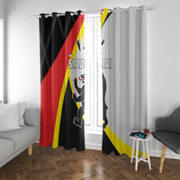 Black and light gray flag print curtains with cat graphic, hung from top rings