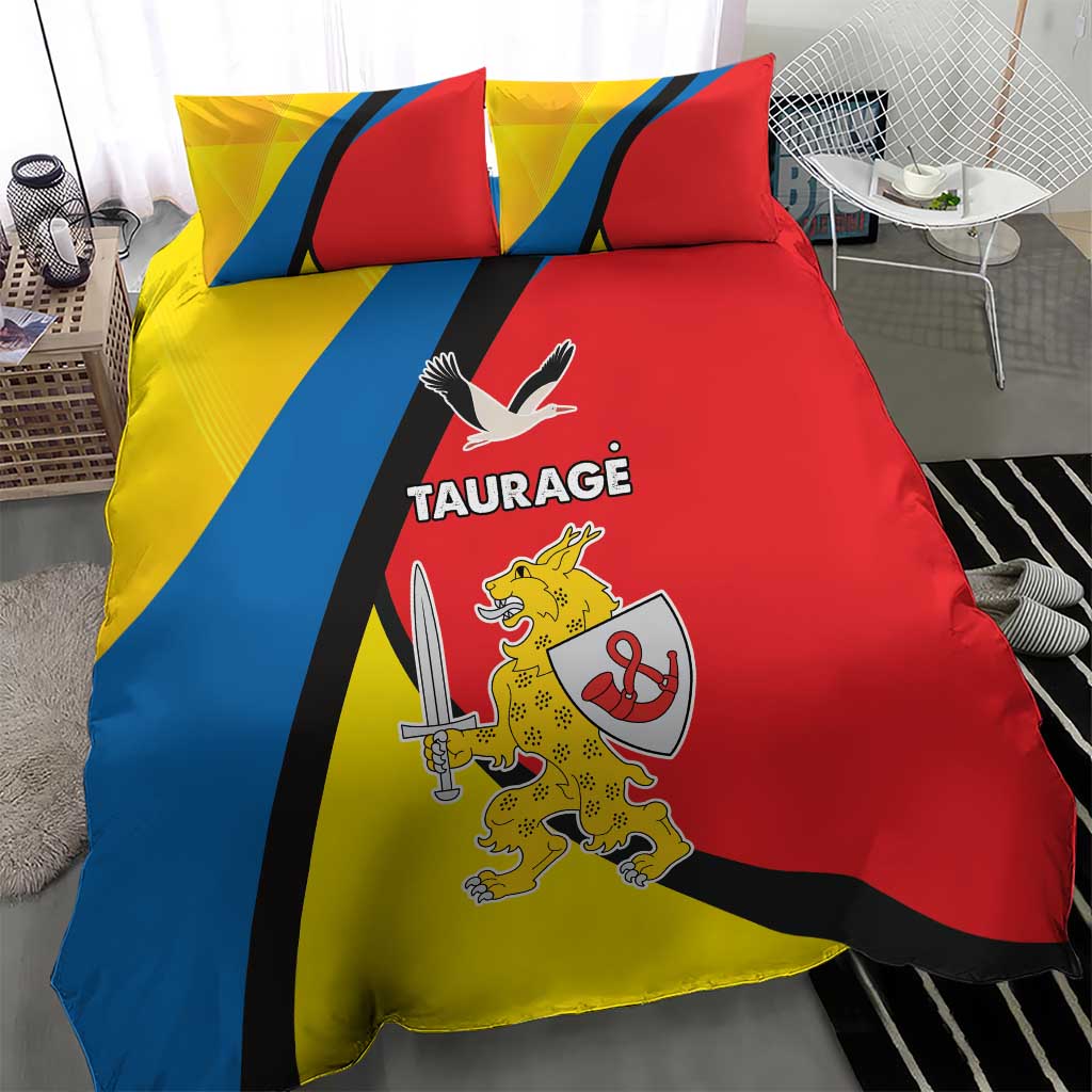 Red, yellow, and blue bedding set with “TAURAGE” text and coat-of-arms graphic