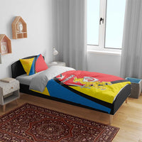 Red, yellow, and blue bedding set on bed with matching pillows and “TAURAGE” print