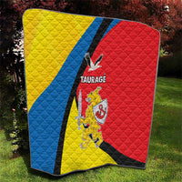 Taurage-themed quilt outdoors, quilted yellow, blue, and red with black diagonal stripe