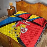 Taurage quilt bed set on bed, red-yellow-blue quilt with black stripe design and crest