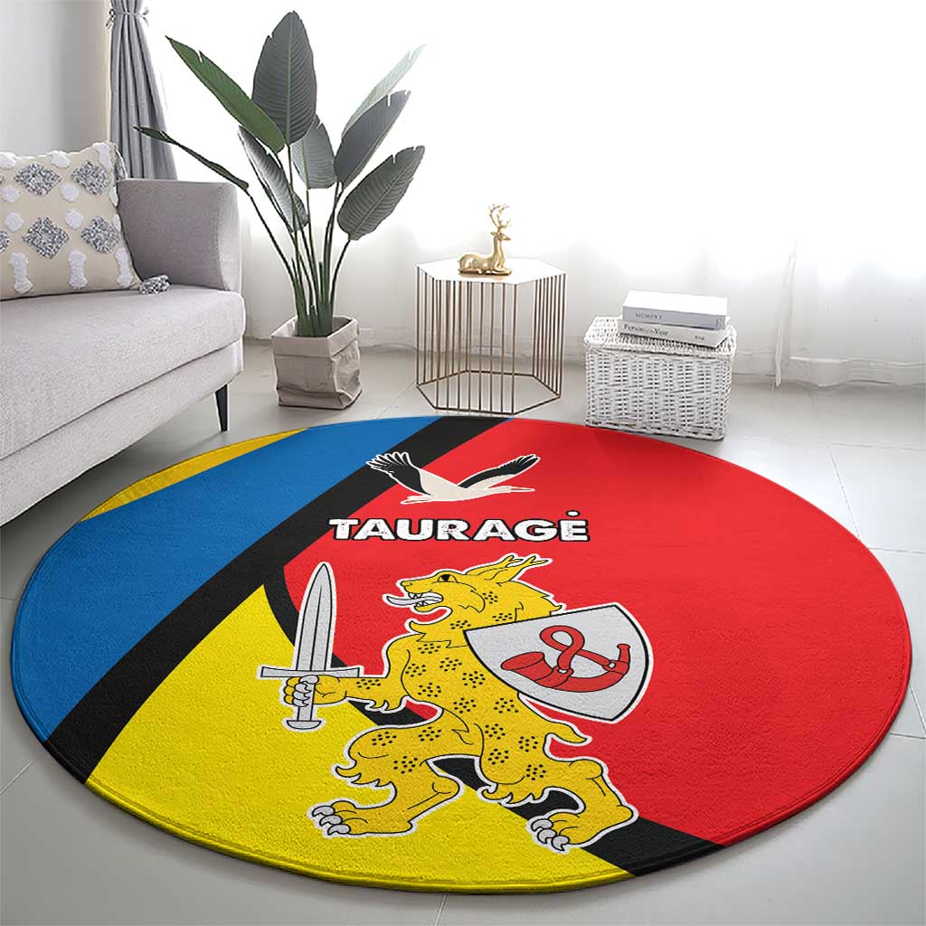 Round carpet rug with Taurage crest in red, blue, and yellow blocks