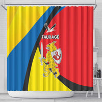 Yellow, blue, red Taurage crest shower curtain, straight-on view with hanging rings.