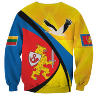 Yellow unisex sweatshirt back with diagonal stripes, bird and lion crest graphic