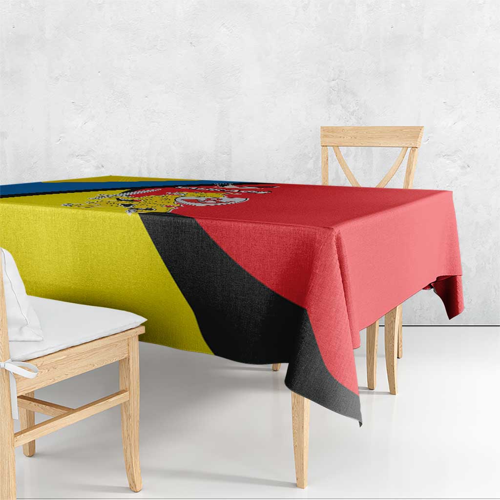 Tablecloth with yellow, blue and black diagonal bands and red solid section.
