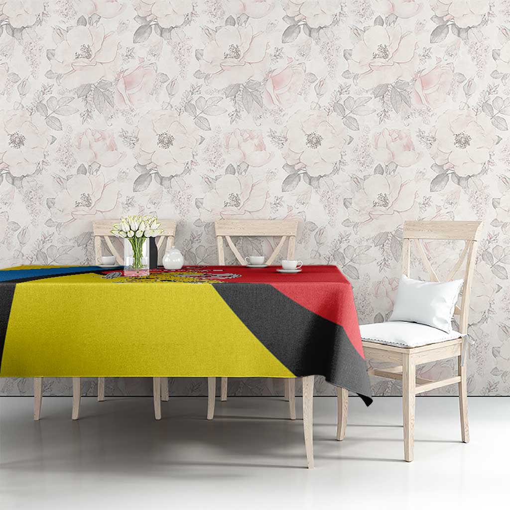 Multicolor diagonal patterned tablecloth in yellow, blue, black and red sections.