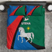 Blue, red and green bedding set with white horse and "UTENA" graphic on duvet