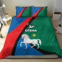Blue, red and green bedding set with UTENA logo, white horse, and matching pillow