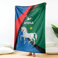 Flag-themed blanket in blue, green, and red with Utena text, horse, and eagle