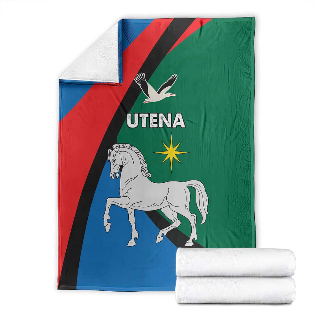 Folded flag-themed blanket with horse, eagle, and Utena text on blue, red, green