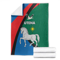 Folded flag-themed blanket with horse, eagle, and Utena text on blue, red, green