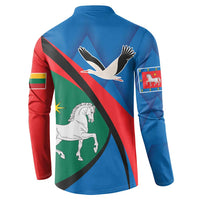 Blue button sweatshirt, back view with bird and horse print plus flag-style diagonal stripe.