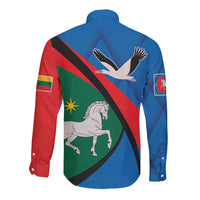 Blue long-sleeve button shirt with crest graphic back, red diagonal stripe and green panel
