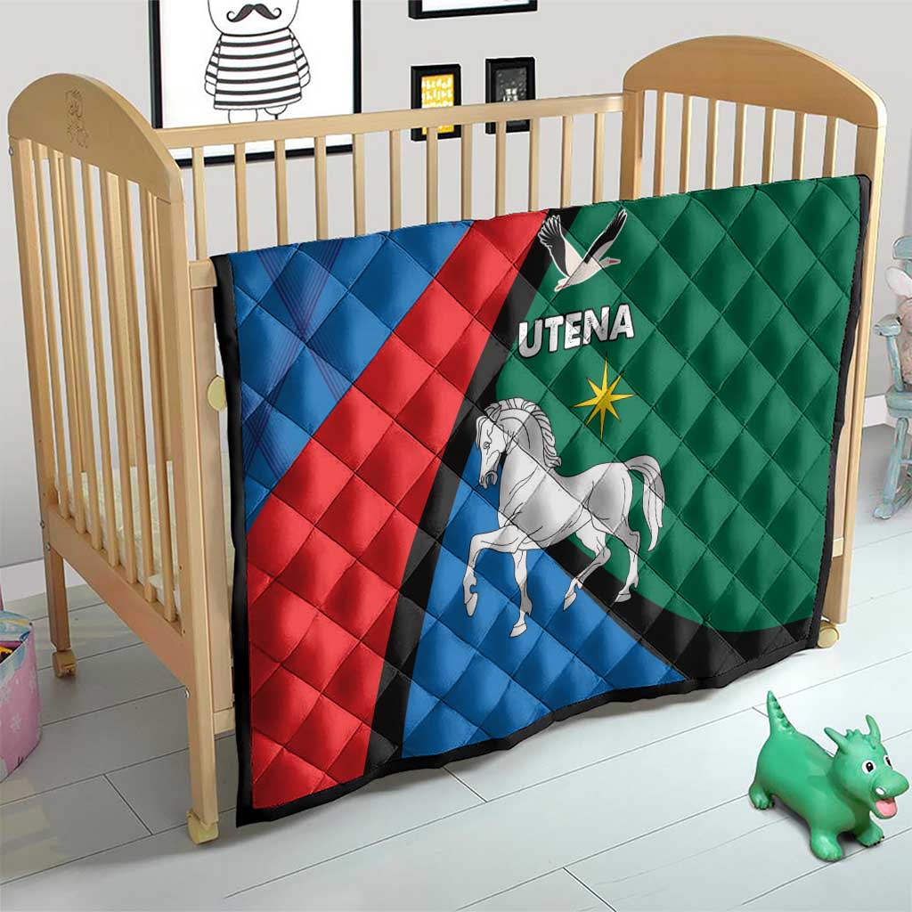 Quilt blanket on crib, blue red green diagonal stripe with horse graphic and Utena text