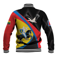 Back of black baseball jacket with striped ribbed cuffs and large colorful crest graphic