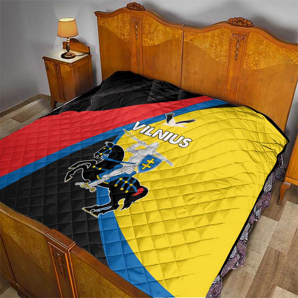 Vilnius flag quilt spread on bed; black, red, yellow, and blue with crest and “Vilnius”