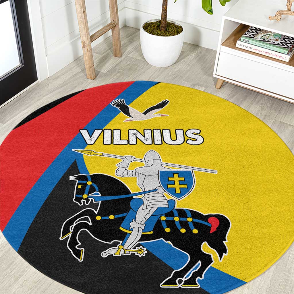 Round carpet with yellow, red, blue and black design featuring Vilnius graphic