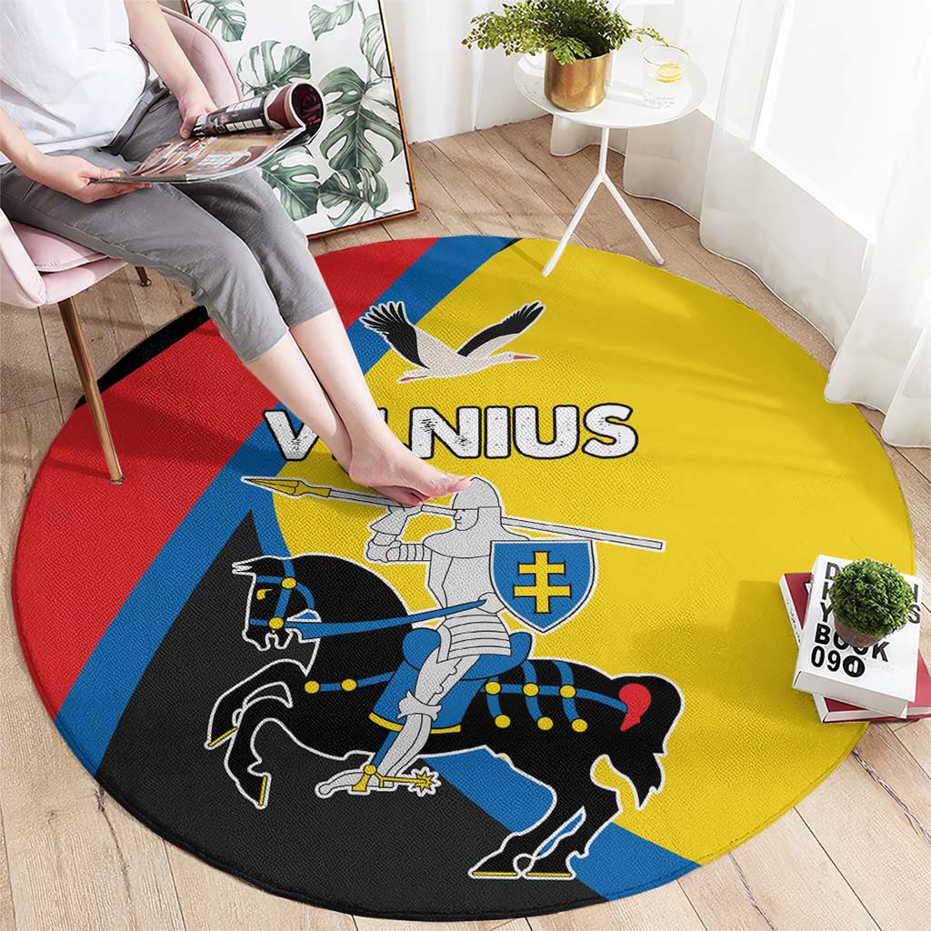 Round carpet with yellow field and red, blue, black accents featuring Vilnius graphic