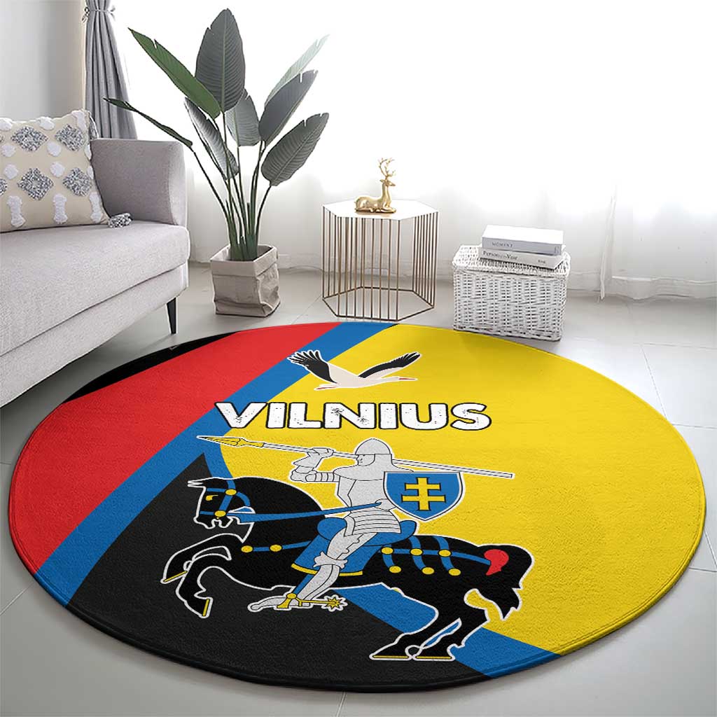 Round carpet with Vilnius graphic, yellow center bordered by red, blue and black