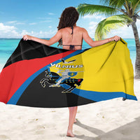 Vilnius-themed sarong draped on a person, showing yellow and blue graphic