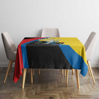 Multicolor tablecloth with yellow and blue diagonal stripe, black panel and red border