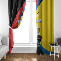 Black and yellow window curtain with Vilnius crest print, partially gathered to the side