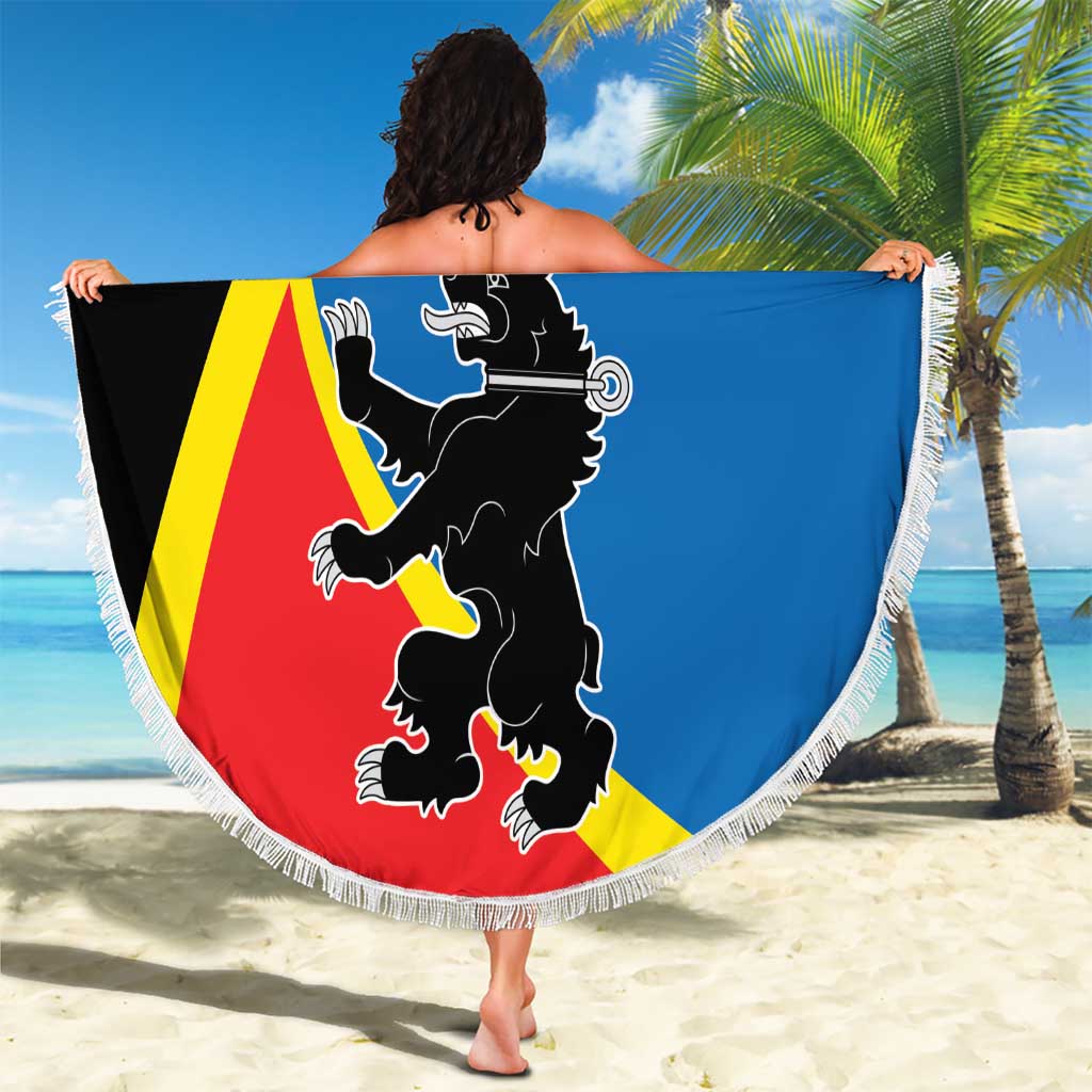 Round beach blanket with fringed edge, lion and bird design with TELSIAI lettering