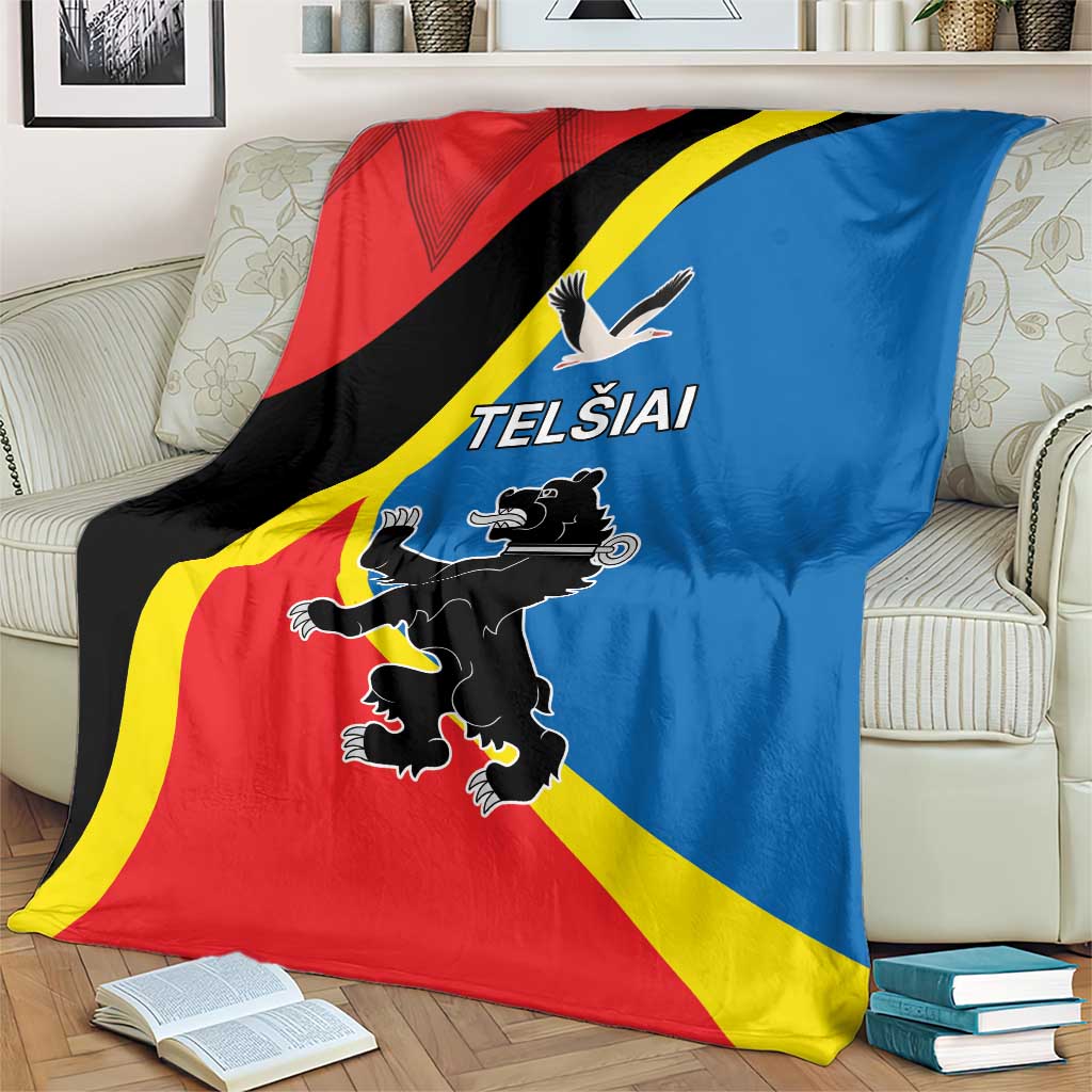 Flag-themed blanket with Telsiai emblem and text, draped over an armchair