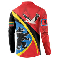 Red button sweatshirt, back view, bird and lion graphic with diagonal blue stripe