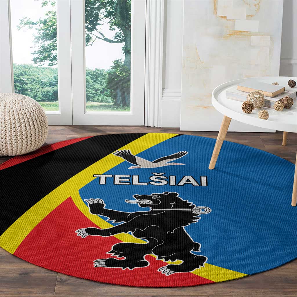 Round carpet with blue field, red border, yellow diagonal stripe, and black emblem
