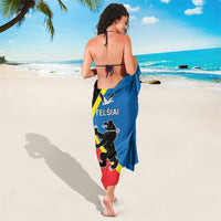 Blue sarong with black coat-of-arms graphic, yellow curved band, and wrap tie
