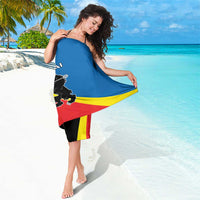 Red, blue, and yellow diagonal striped sarong with black lion coat-of-arms