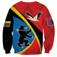 Unisex crewneck sweatshirt, red back with bird-and-bear diagonal graphic and sleeve patch.