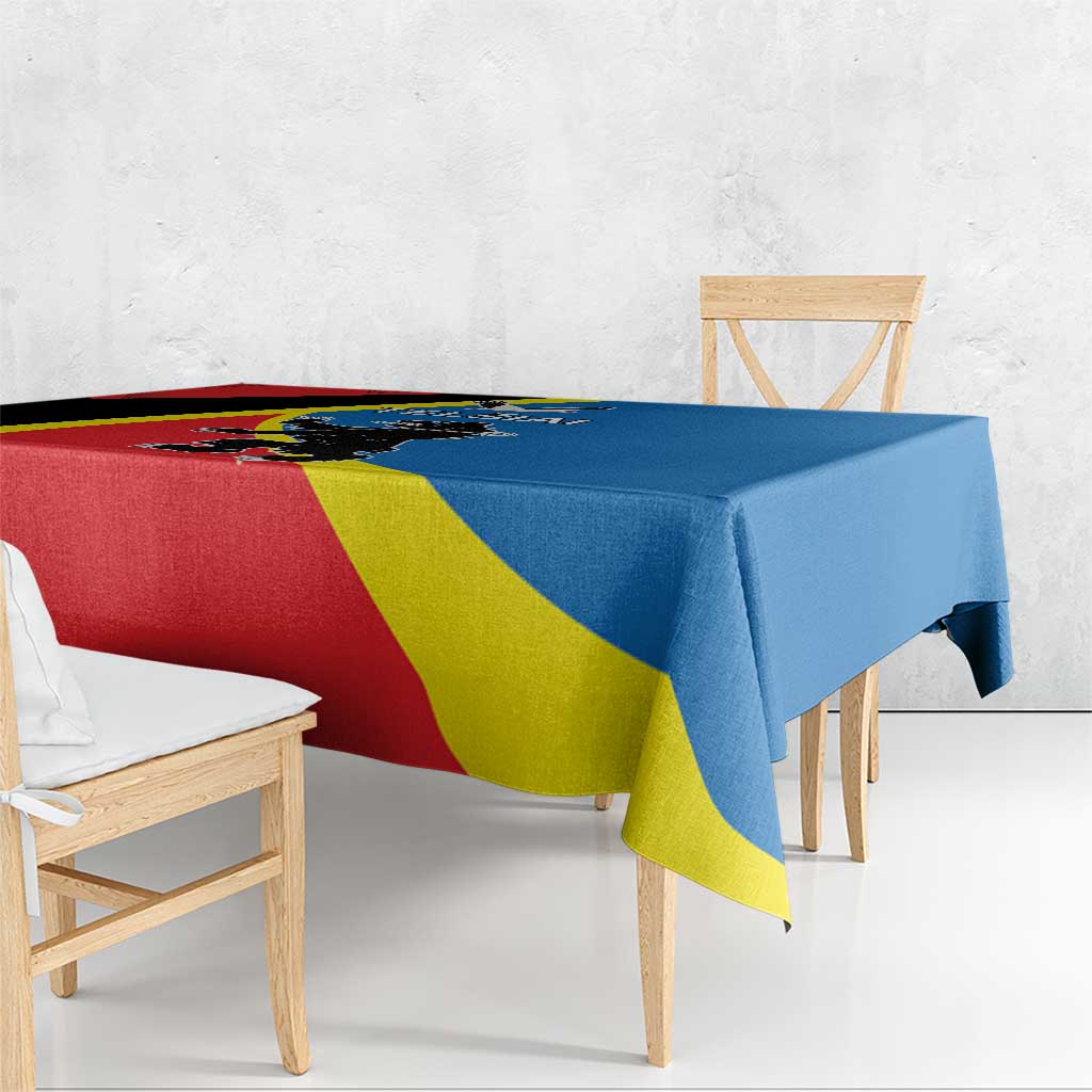 Square tablecloth edge view with red, yellow, blue flag pattern and black stripe