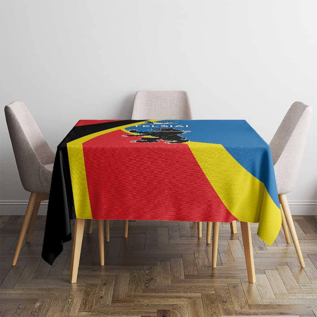 Flag-themed tablecloth with red, yellow, blue panels and black diagonal band, front view