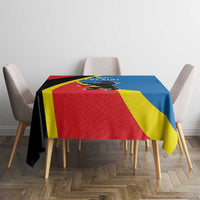 Flag-themed tablecloth with red, yellow, blue panels and black diagonal band, front view