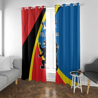 Printed window curtains on rod with red left panel and blue right panel, full length
