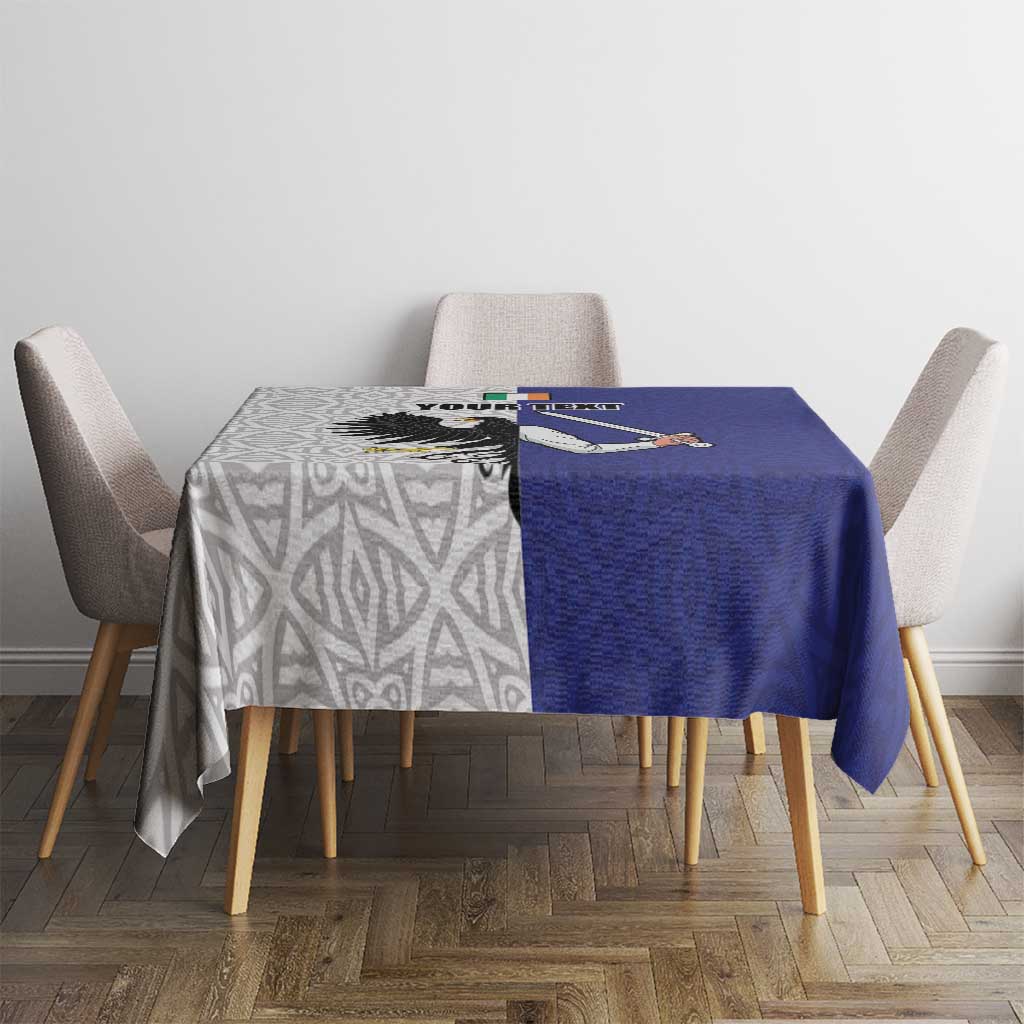 Blue personalized tablecloth on dining table with eagle motif and celtic geometric pattern