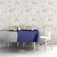 Blue tablecloth on dining table with eagle graphic and geometric pattern
