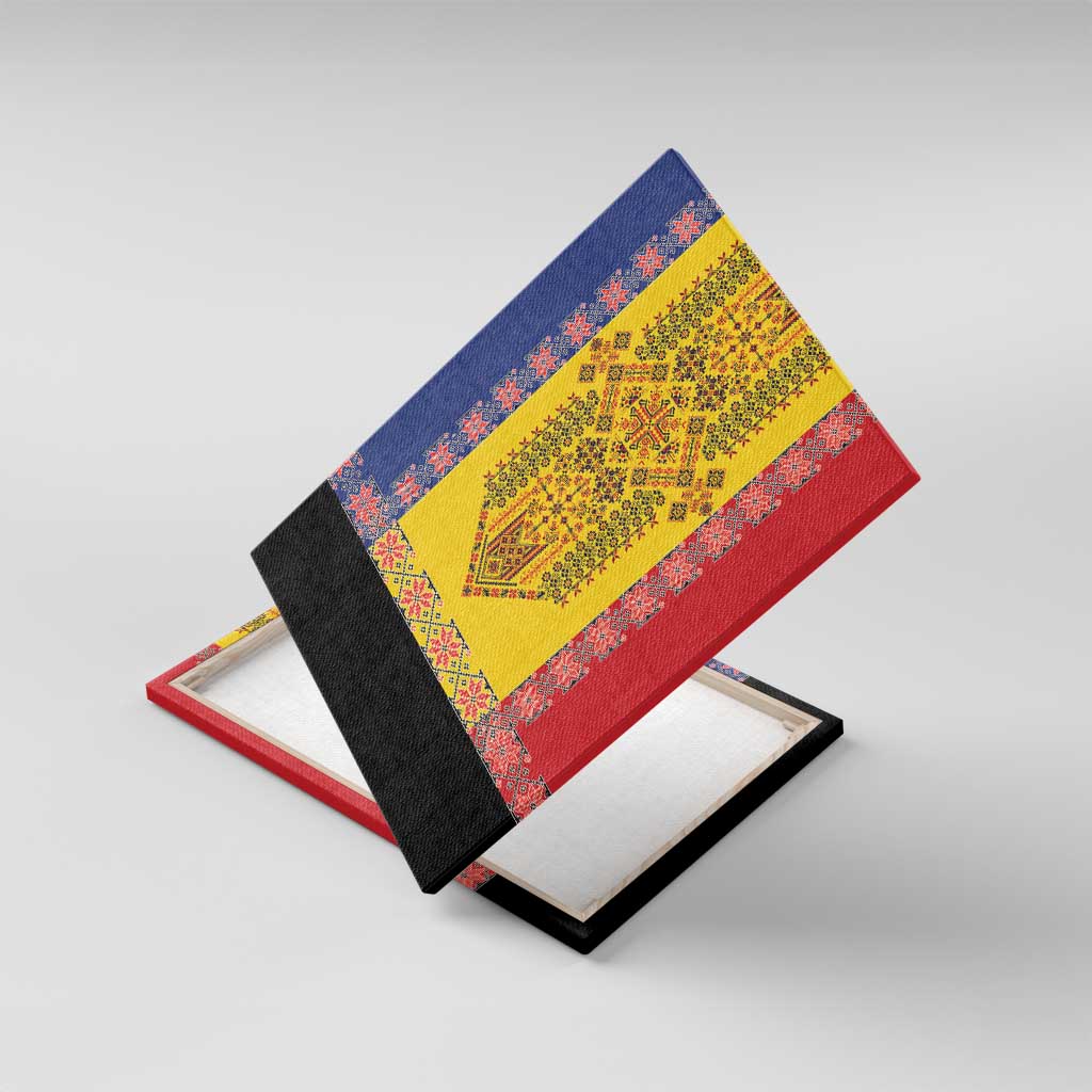 Framed canvas wall art angled on display stand with blue, yellow, and red embroidery design