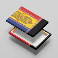 Framed canvas wall art angled view showing black trim over red, blue, and yellow pattern