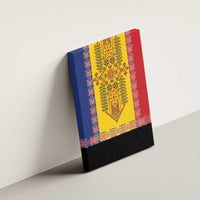 Framed canvas wall art mounted on wall with blue, yellow, and red geometric embroidery center