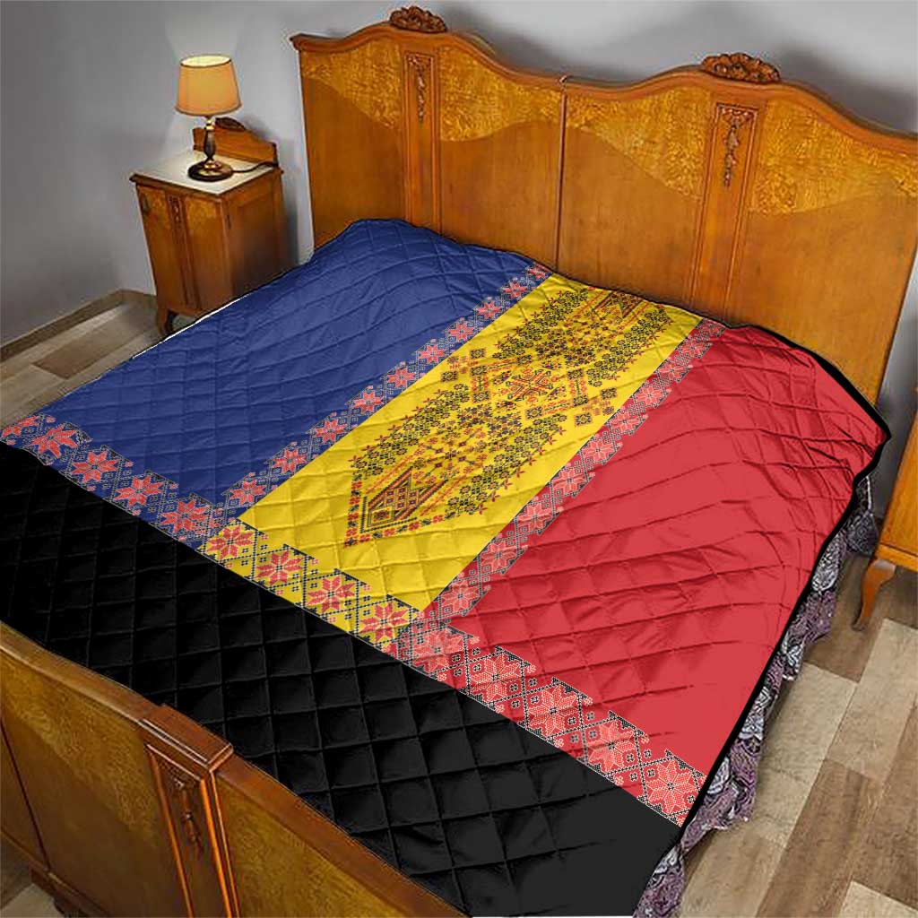 Quilt on bed with blue, yellow, and red embroidered bands and black diamond section