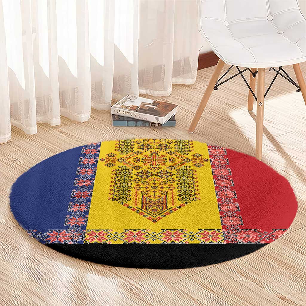 Round traditional embroidered carpet with yellow center, red and blue patterned sections, black edge