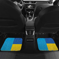 Set of 4 car floor mats with blue and yellow flag stripe design and emblem pattern