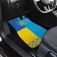 Car floor mat with blue and yellow flag design, emblem graphic, 'YOUR TEXT' label